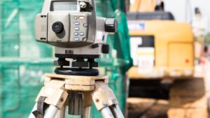 High-precision digital total station on a tripod for accurate topographic and measured building surveys
